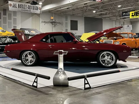 The Camaro on its show platform behind the DMC display stand